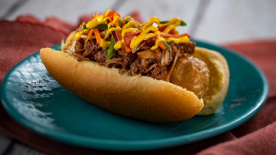 •	Plant-based Bratwurst with spicy turmeric aïoli, coffee barbecue jackfruit, and slaw  from the Refreshment Outpost