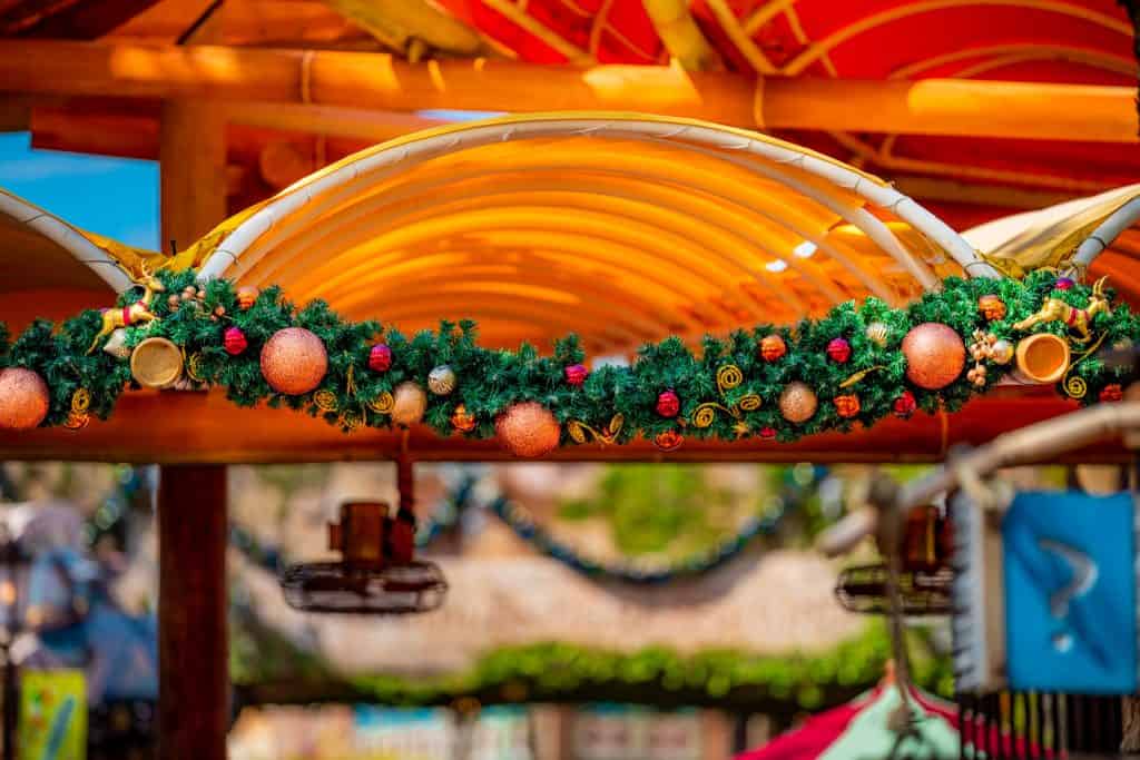 Garland overhead the Islands of Adventure turnstiles