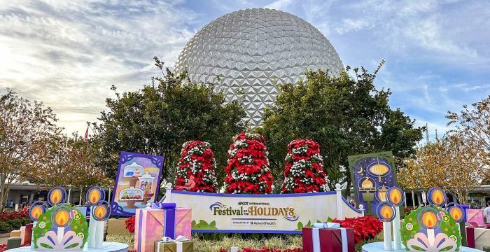 wdw-2023-epcot-spaceship-earth-entrance-stock-festival-of-the-holidays-sign-700x525.jpg