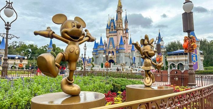 wdw-2024-mk-hurricane-helene-mickey-minnie-statues-disney-fab-50-cinderella-castle-stock-cloudy-rainy-700x525.jpg